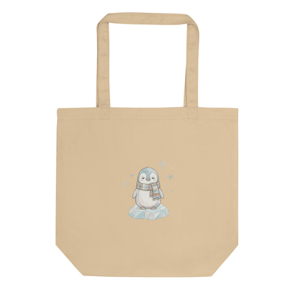 Sac tote bag naissance bébé illustration aquarelle d'un pingouin somnolent enveloppé dans une écharpe rayée pastel, sur fond blanc — toile coton 38×42 cm